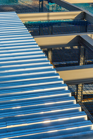 A construction site with I-beam steel framing and steel decking on topの写真素材
