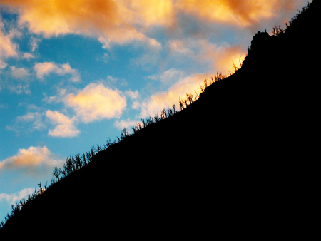 Cloudy sunset behind a mountain in Andes, Argentinaの写真素材