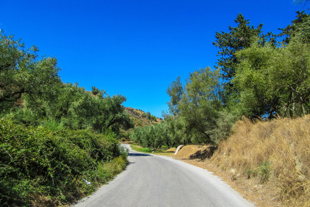 Local road trough the hills of Zakynthos island, Greece, sunny summer dayの写真素材