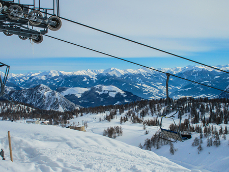 Ski chairlift in alpine resort - Austriaの写真素材