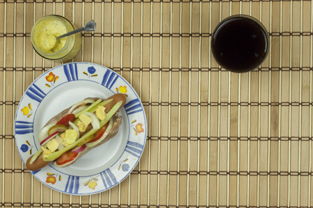 Domestic hotdog with vegetables fast food preparation at home.の写真素材