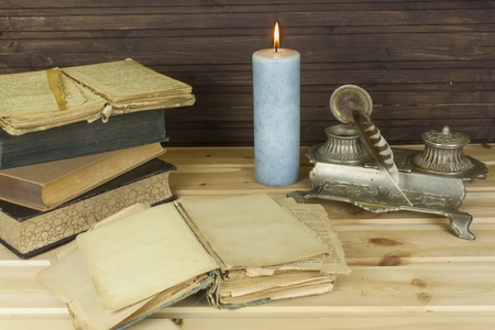 Old books to read. Studying old dictionaries. Historical Library, reading by candlelight.の写真素材