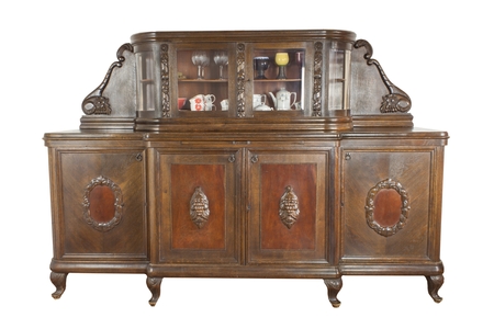 Vintage wooden art Nouveau cabinet isolated on white background. Historical cabinet with glass showcase. Insight into the history of furniture manufacturing.の写真素材