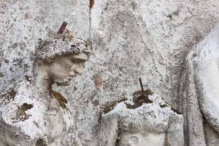 Detail of the face smashed historic statues. Torso of ancient statues. Lost sculpture. The effects of weathering on the artwork.の写真素材