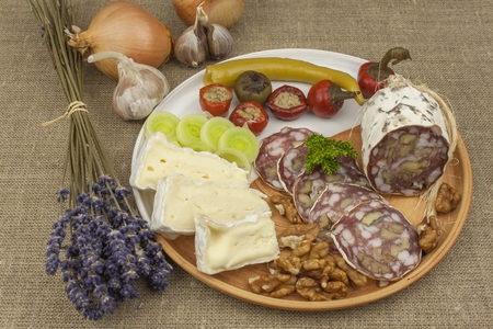 Delicious specialty food, salami with walnuts. Refreshments for important guests. Traditional specialty food. Preparation of home entertainment.の写真素材