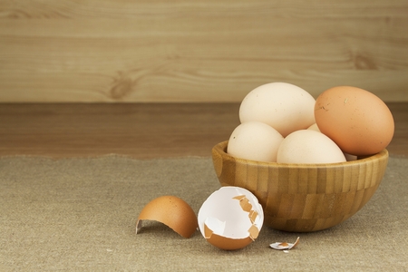 Homemade chicken eggs. Traditional food with protein. Eggs on the table, food preparation. Preparing...