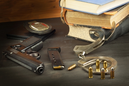 Police gun and badge. Weapons to defend law and order. The right to own a gun. Defense Law....