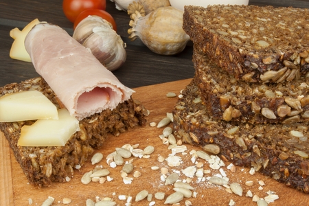 Freshly baked whole wheat bread. Preparing homemade breakfast. Various ingredients for the meal....