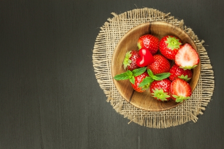 Strawberry on a wooden background. Advertising for the sale of fresh strawberries.の写真素材