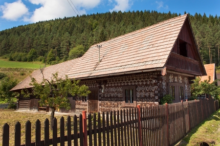 CICMANY, SLOVAK REPUBLIC, AUGUST 23, 2016: Traditional folk architecture. The old wooden house painted ornament.のeditorial素材