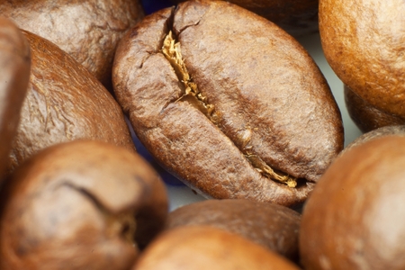 Details of Roasted coffee beans. Close up shot of a pile of roasted coffee beansの写真素材