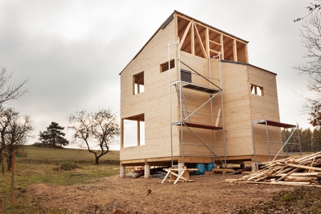 Empty building site ecological house. External work on the building envelope. The wooden structure of the house.の写真素材