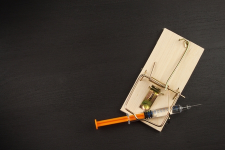 Mousetrap with sirynge. Drug addiction. Drug trap.の写真素材