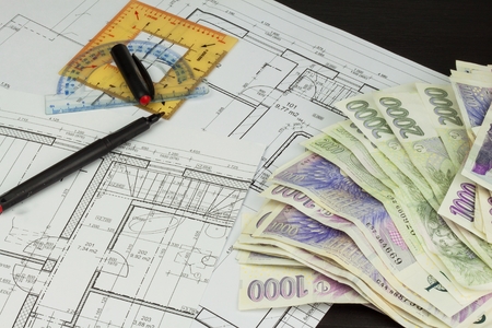 Money to build a house. Mortgage installment. Valid Czech banknotes. Part of architectural project, architectural plan, technical project, construction plan.の写真素材