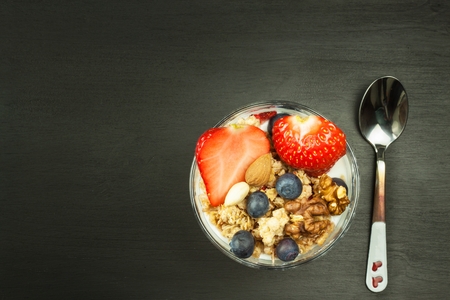 Blueberries and oatmeal. Healthy food for kids. Yogurt and fruit for athletes. Diet food.の写真素材