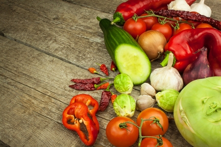 Fresh vegetables on an old wooden table. Preparing vegetarian food. Diet Food. Sales of vegetables.の写真素材