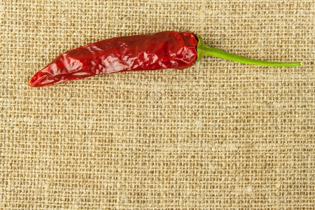 Detail of dried chillies on fabric background. Spices for grilling. Sale of spices.の写真素材
