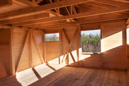 Wooden beams on the construction of ecological buildings. Construction site timber constructionの写真素材