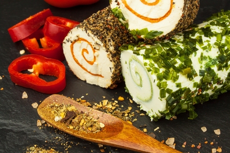 Spicy cheese. Homework cheese to eat. Cheese and spices. Advertising for the saleの写真素材