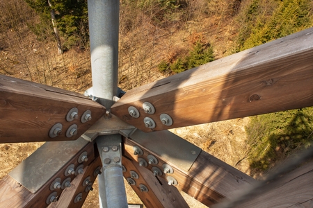 Wooden beams with screws in the structure. Assembling and connecting wooden beams. Detail of...