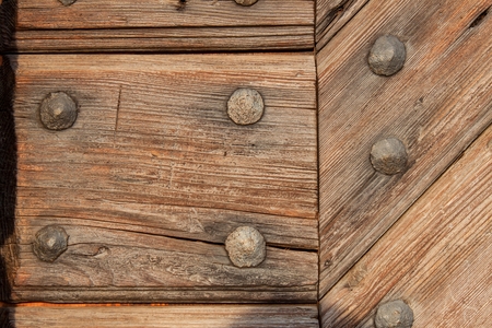 Old wooden boards with nails. Place for text. The wooden door of the castleの写真素材