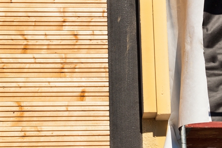 Polystyrene insulation of wood buildings. Eco-friendly building insulationの写真素材