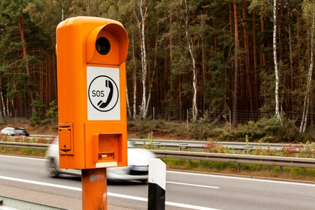SOS phone.  Emergency telephone at the roadside. Morning on the German highwayの写真素材