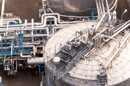 Industrial concept. Liquid gas container.  Gas storage in the port. Pipelines in the refinery