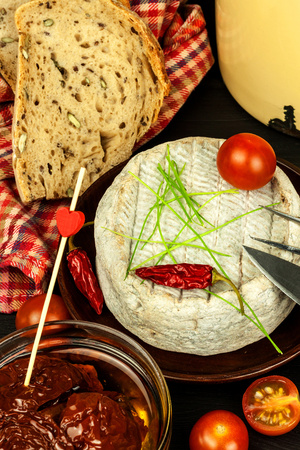 Homemade mature mold cheese. Dairy product. Aromatic cheese with mold