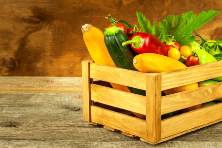Fresh vegetables on a wooden table. Harvest of vegetables. Healthy food. Raw food. Life on the farmの写真素材