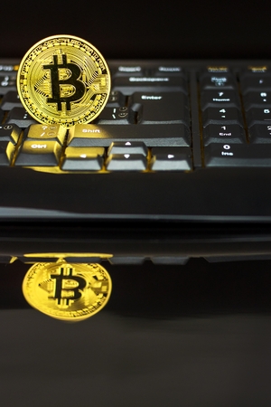 Bitcoin on a black computer keyboard. E-commerce. Virtual currency. Exchange speculation. Loss on the stock exchange. Share priceの写真素材
