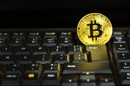 Bitcoin on a black computer keyboard. E-commerce. Virtual currency. Exchange speculation. Loss on the stock exchange. Share priceの写真素材