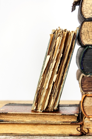 Old books on white background. Study of old books. Damaged books. Old Library.の写真素材