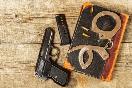 Police desk. Books of laws and police handcuffs. Investigation of crime. Top view. Law and Order.