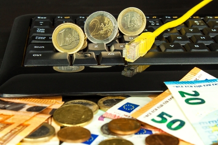 Computer keyboard and euro banknotes. Internet banking. Networking. Secure payments.の写真素材
