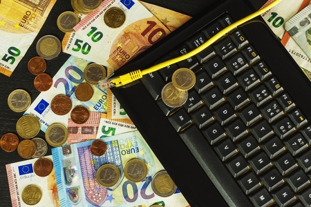 Computer keyboard and euro banknotes. Internet banking. Networking. Secure payments.の写真素材