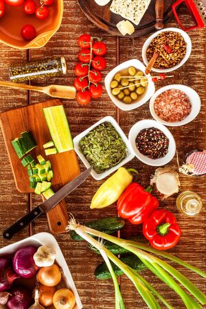 Preparation of vegetable salad with cheese. Diet healthy food. Summer salad with tomato and pepper. Vegetarian food.の写真素材