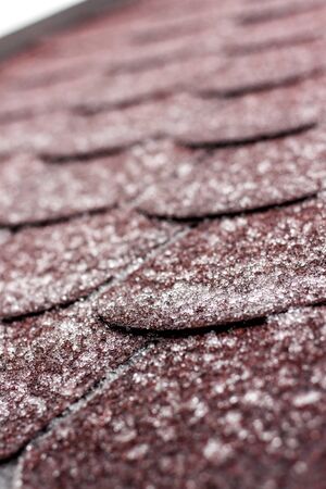 Frost on the roof of the terrace. Ice roof coating. Cold weather. Ice crystals on the roof covering.の写真素材