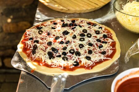 Tasty hot italian pizza with ham, mushrooms and olives.  Traditional Italian food. Concept poster...