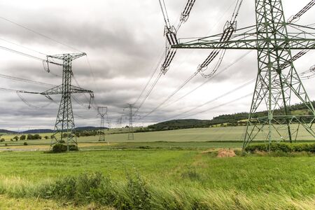 Electricity distribution - Czech Republic. Cloudy sky. high-voltage electric pole,high voltage power supply in cloudy day.の写真素材