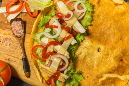 Egg omelette with vegetables, cheese and grilled chicken. Keto diet. Protein for athletes. Barbecue season.の写真素材