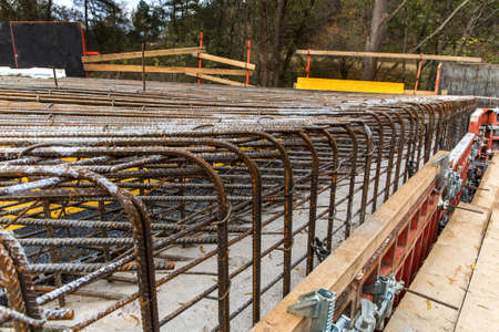 Construction site of a road bridge in the countryside in the Czech Republic near the village of Rikonin. Concrete structure. Reinforcing iron.の写真素材