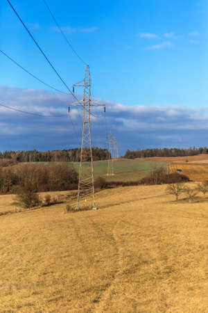 High voltage power tower and beautiful nature landscape in the Czech countryside. Electricity distribution concept. Green deal. Clean energy.の写真素材