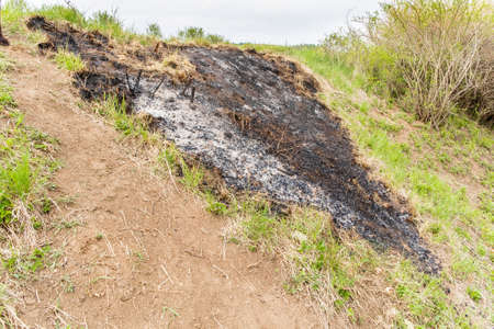 Burnt Grass. Burned Grass Hotsell. Burning grass on the hillside.
