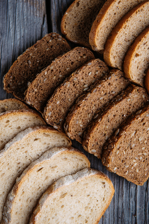 Different bread slices, pastries combination, bread with grains, food backgroundの写真素材