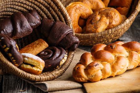Christmas cake and sweet pastries in basket, background for bakery or marketの写真素材