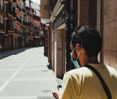 young man savoring a vermouth in a city barの写真素材