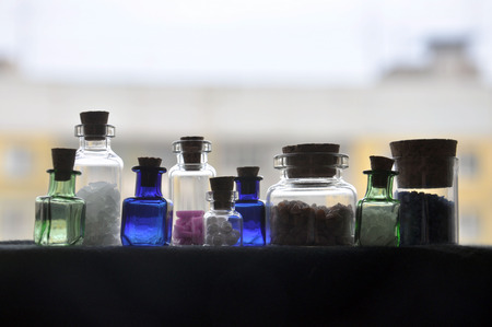 Nine small glass bottlesの写真素材