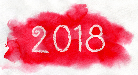New Year 2018. White lettering made by wax crayons on the red watercolor background.の写真素材