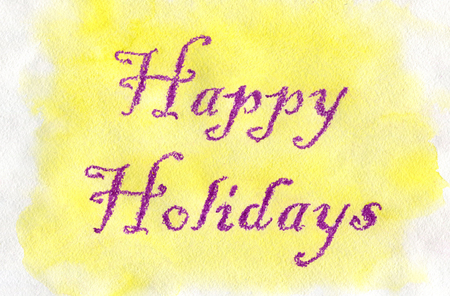 Happy Holidays. Violet lettering made by wax crayons on the yellow watercolor background.の写真素材